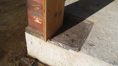 HSS column welded to a steel baseplate embedded in concrete slab
