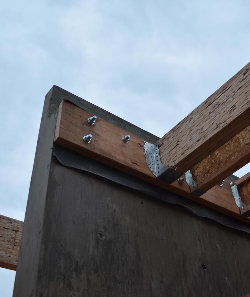 connection-between-parallam-beams-and-concrete-wall-through-a-ledger-beam